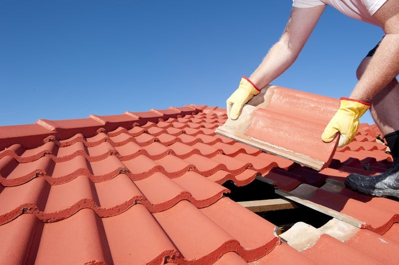 roofer working on a tiled roof